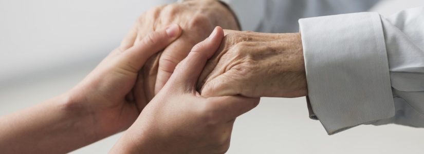 nurse-holding-senior-man-s-hands-sympathy nurse-holding-senior-man-s-hands-sympathy